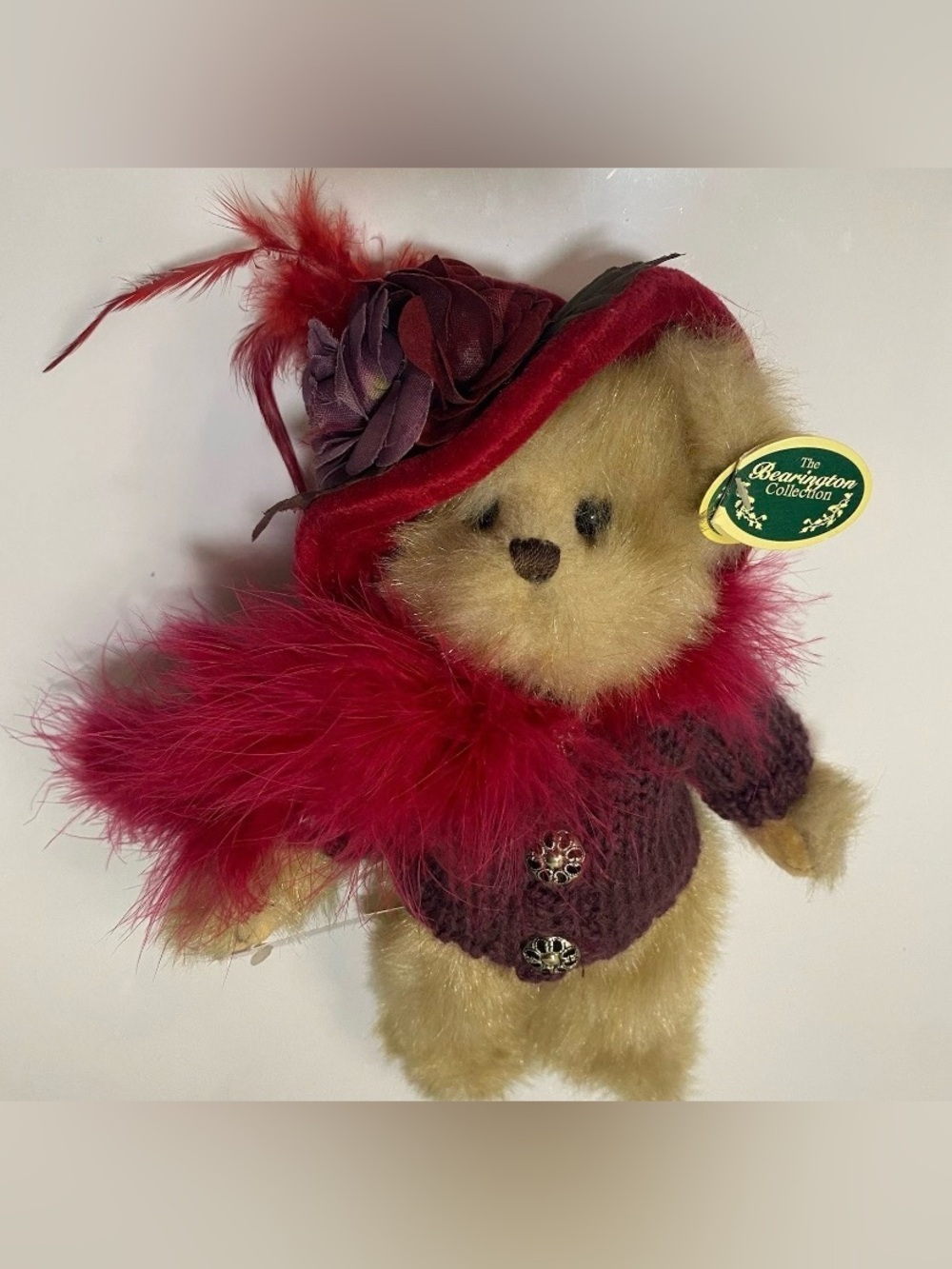 Vintage Bearington Collection bear with red velvet hat, feather boa, and sweater